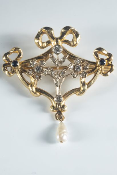 White and yellow gold (750 thousandths) floral...
