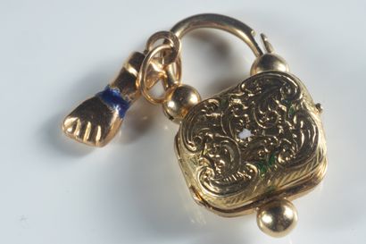 2 lock and hand pendants in yellow gold....