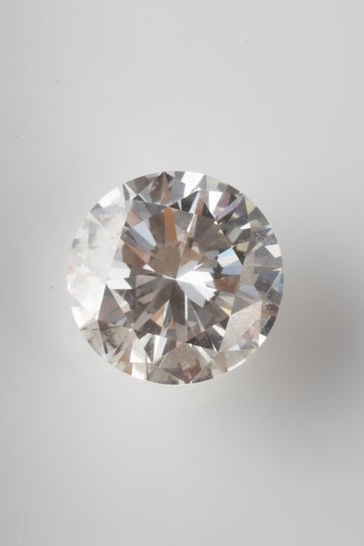 Brilliant-cut diamond on paper weighing 1.96...