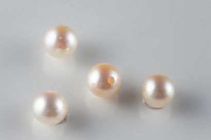 4 white cultured pearls with a piercing hole...