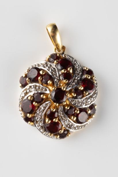 Pendentif rosace en or jaune et bicolore...