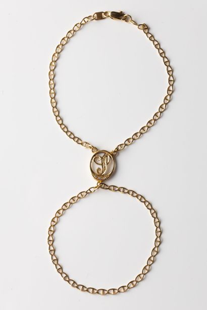 Finger bracelet adorned in a medallion with...