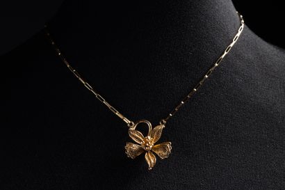 Necklace centered on a filigree orchid in...