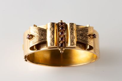 Large open-work bangle decorated with chased...