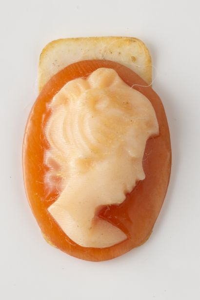 Small oval cameo with profile of a woman...