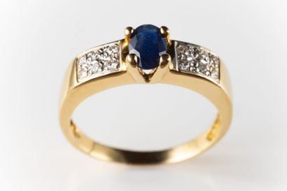 Yellow gold (750 thousandths) ring centered...