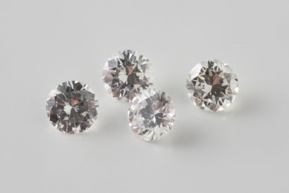 4 brilliant-cut diamonds on paper weighing...