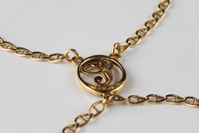 Finger bracelet adorned in a medallion with...