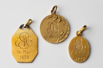 3 religious medals, 2 of a virgin and one...