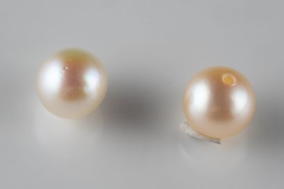 2 white cultured pearls with a 5.9 mm ho...