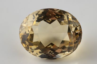 Oval citrine on paper weighing 27.80 carats,...