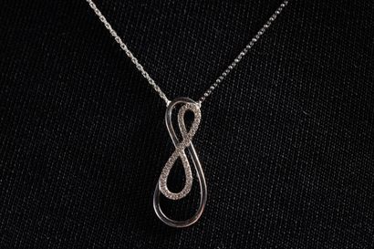 Necklace adorned with a coiled motif set...