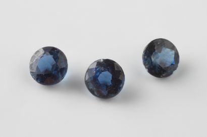 3 round sapphires on paper totaling approximately...