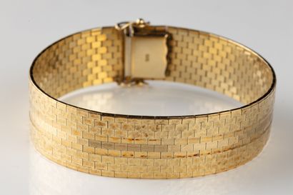 Ribbon bracelet adorned with briquettes on...