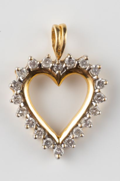 Heart pendant set with a border of diamonds...