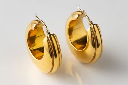 Large pair of creole earrings in yellow gold...