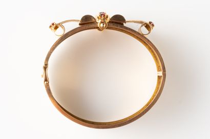 Large open-work bangle decorated with chased...