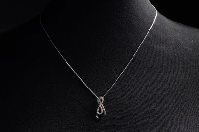 Necklace adorned with a coiled motif set...