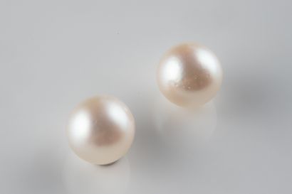 2 white cultured pearls with a 5.4 mm ho...
