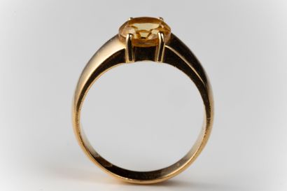 Ring set with an oval faceted citrine in...