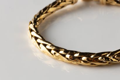 Bracelet accidenté maille palmier en or jaune...