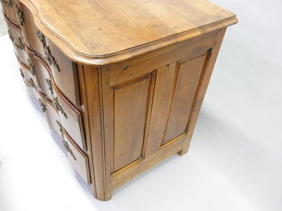 * Natural wood crossbow-front chest of drawers...