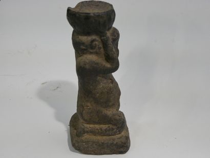 Stone sculpture with crusty patina depicting...