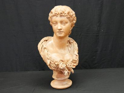 * Bust of a woman with a flowery bun on a...