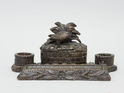 Carved wood inkwell with bird and well decoration....