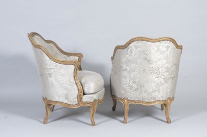 Pair of small bergères in molded and carved...