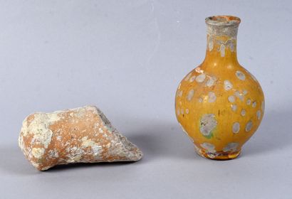 Yellow glazed terracotta bottle. An amphora...