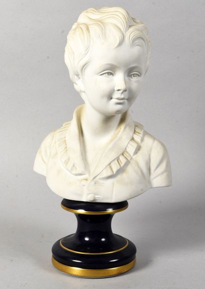 LIMOGES
Bisque bust of a young boy standing...