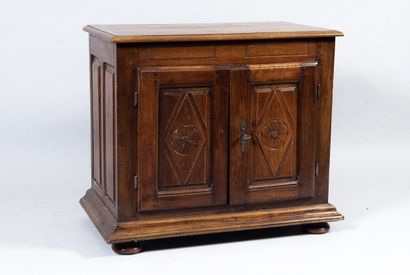 Small wooden sideboard opening with two leaves...