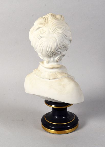 LIMOGES
Bisque bust of a young boy standing...