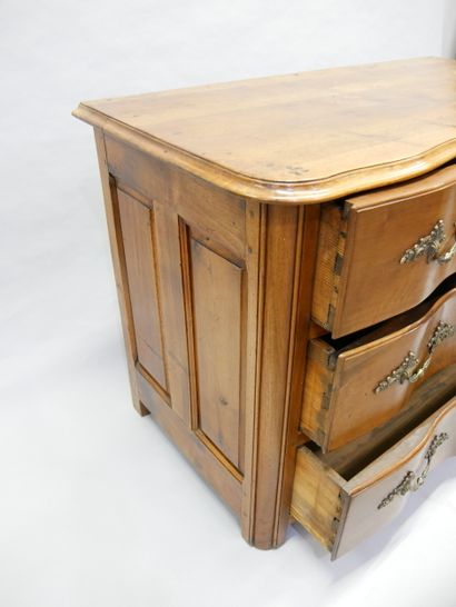 * Natural wood crossbow-front chest of drawers...
