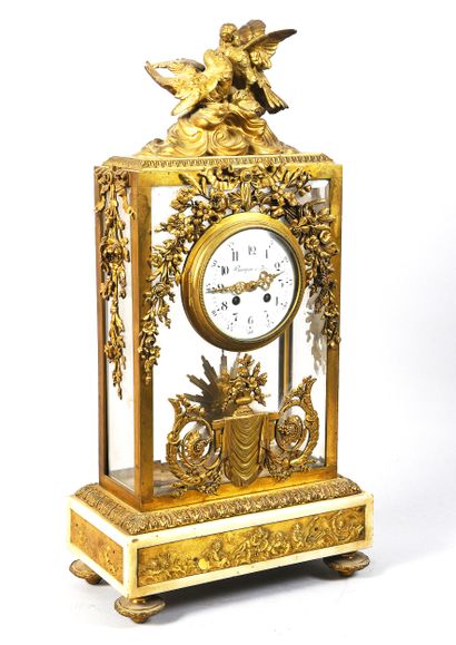 Gilt bronze cage clock on marble base decorated...