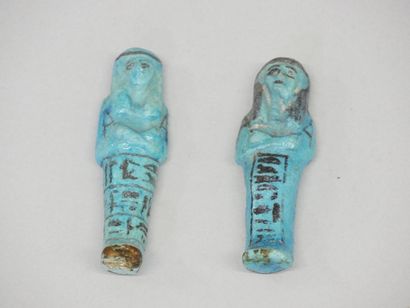 Two chaouabtis, one with a column painted...