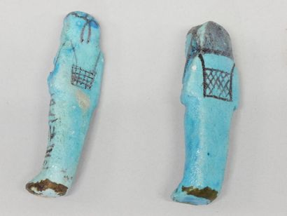 Two chaouabtis, one with a column painted...