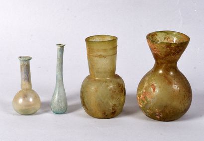 Set consisting of a tubular-necked bottle...
