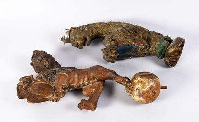 Two carved and polychromed wooden decorative...