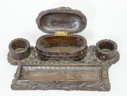 Carved wood inkwell with bird and well decoration....