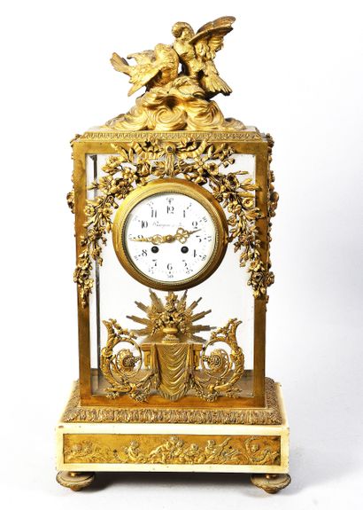 Gilt bronze cage clock on marble base decorated...