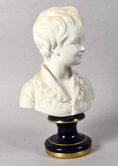 LIMOGES
Bisque bust of a young boy standing...