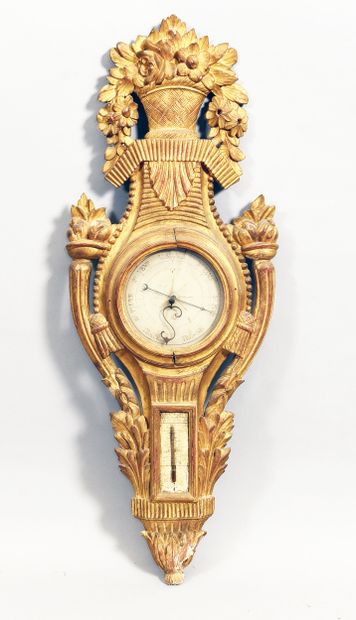 Carved and gilded wood barometer adorned...