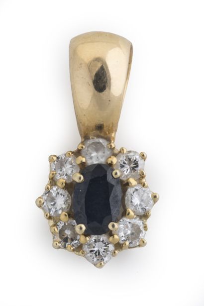 Daisy pendant centered on an oval sapphire...