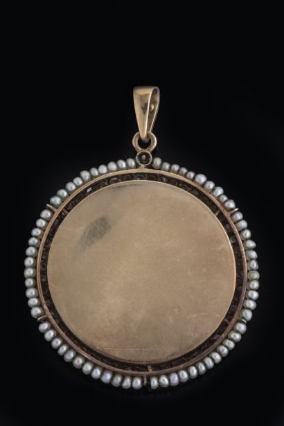 Large white mother-of-pearl medal depicting...