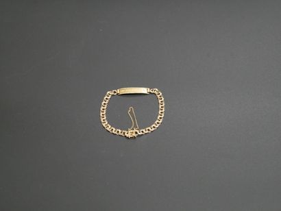 Adult identity bracelet adorned with an engraved...