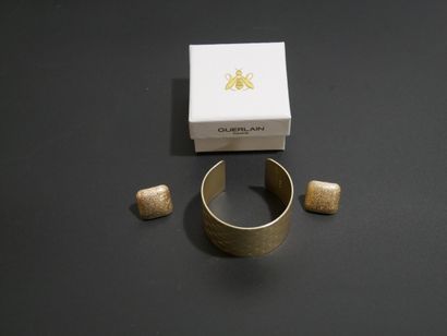 Guerlain Paris cuff bracelet in gilded metal...