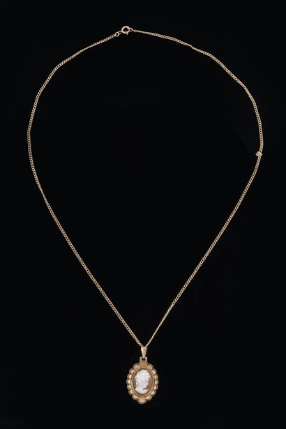 Curb chain with shell cameo pendant featuring...