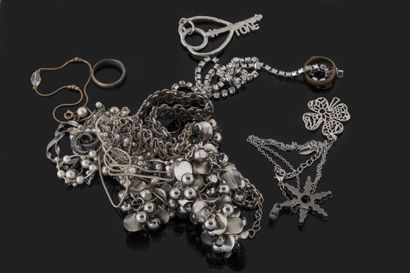 Set of white metal costume jewelry including...